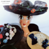 1920s raffia hat with poppies and other antique hats