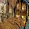 1950s Christian Dior gold shoes with 1920s lame shoes surrounded by lame textiles